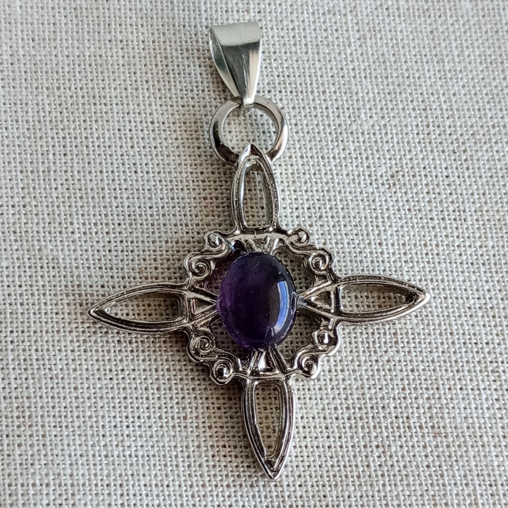 Dije nudo de bruja con piedra rolada